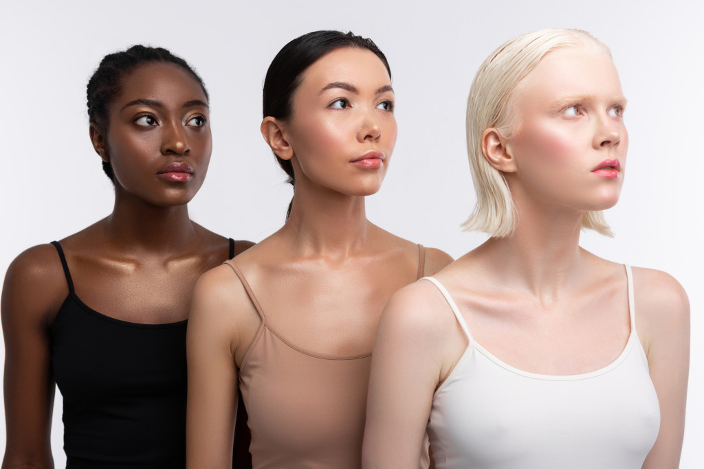 three women with different skin tones
